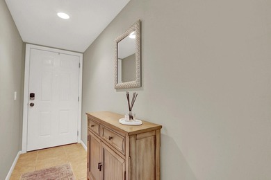 This two-bedroom, two-bath condominium offers a relaxed - photo 3