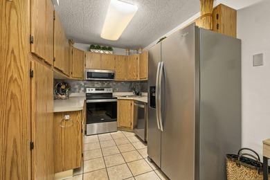 Move-in ready 3-bedroom, 2-bath second-floor condo in the gated - photo 9
