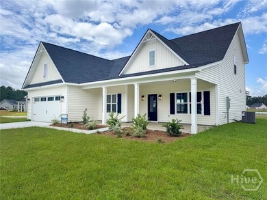 Two-story home featuring a main-floor primary suite on a - photo 1