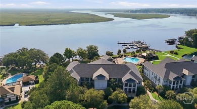 Experience elevated, maintenance-free waterfront living in this - photo 1