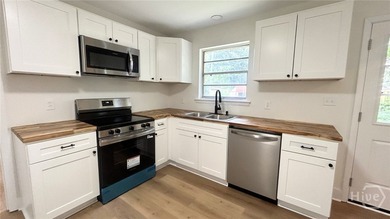 Looking for your first home? This beautifully updated solid - photo 10