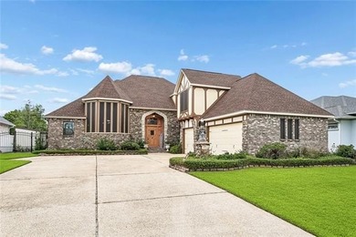 Welcome to this stunning English Tudor-style waterfront home in - photo 2
