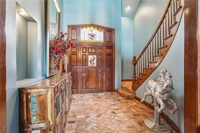 Welcome to this stunning English Tudor-style waterfront home in - photo 3