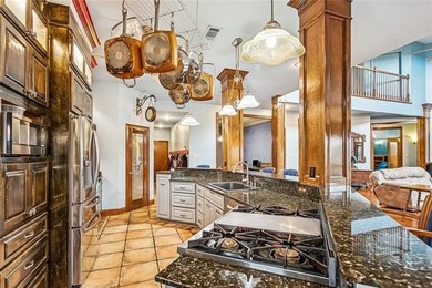 Welcome to this stunning English Tudor-style waterfront home in - photo 6
