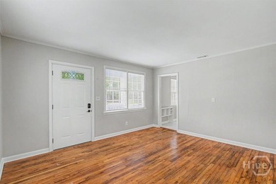 Step inside to discover gorgeous original hardwood floors - photo 3