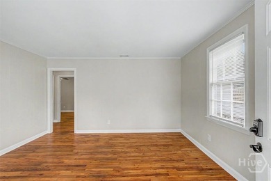 Step inside to discover gorgeous original hardwood floors - photo 4