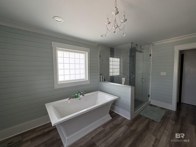 This custom waterfront home is located in the most convenient - photo 16