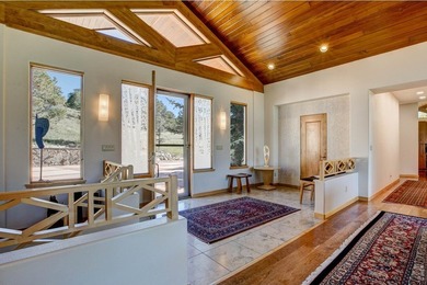Perched in a peaceful, private setting with sweeping views of - photo 7