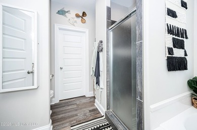 Tucked away in a charming coastal town, this 4-bedroom, 2-bath - photo 17