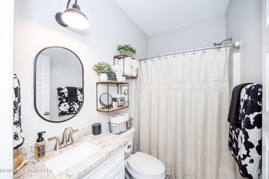 Tucked away in a charming coastal town, this 4-bedroom, 2-bath - photo 23