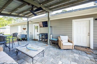 Tucked away in a charming coastal town, this 4-bedroom, 2-bath - photo 32