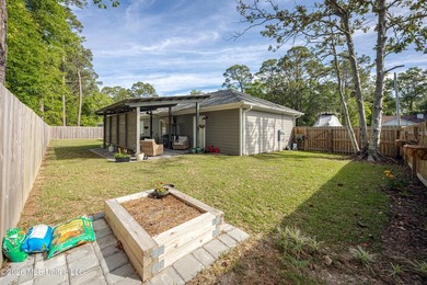 Tucked away in a charming coastal town, this 4-bedroom, 2-bath - photo 35