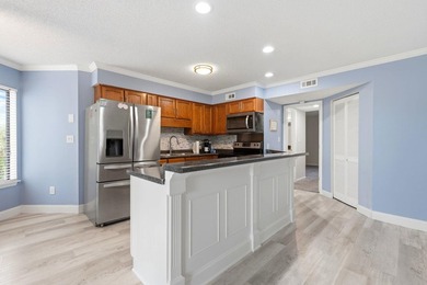 Welcome to Golf Glenn Villas! This inviting 2 bedroom, 2 bath - photo 16