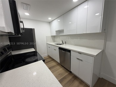 Centrally located and beautifully remodeled 2/1 condo featuring - photo 3