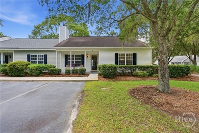 Tucked away on Wilmington Island, this two-bedroom, two-bathroom - photo 1