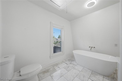 Classic architecture meets modern living in this beautifully - photo 23