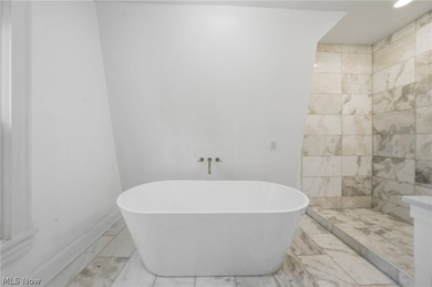 Classic architecture meets modern living in this beautifully - photo 24