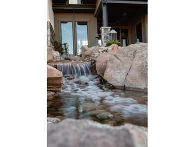 Backing breathtaking water and mountain views, this stunning - photo 4