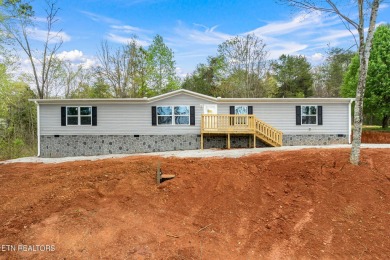 Looking for affordable lake views and mountain views ?  This .72 - Lake Home For Sale in Kingston, Tennessee