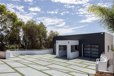 Perched in the hills of Panorama Heights in North Tustin, this - photo 1