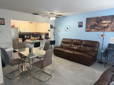 Bright first-floor 2/2 unit featuring ceramic tile, full - photo 4