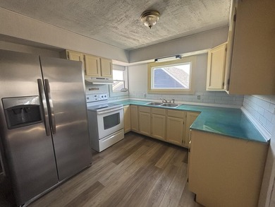 This four-bedroom home is situated across the street from open - photo 17