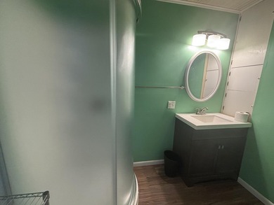 This four-bedroom home is situated across the street from open - photo 30