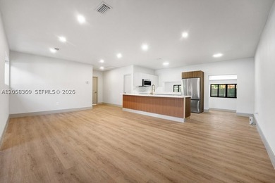 Welcome to this stunning 3-bedroom, 3-bathroom home tucked into - photo 4