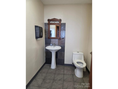 Property sits on entire parcel and has an ownership interest in