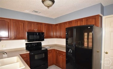 Welcome home to this spacious 5-bedroom, 2.5-bath residence in - photo 4