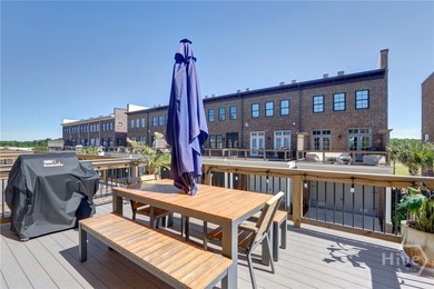 This spacious three-story townhouse offers 2,118 square feet of - photo 3