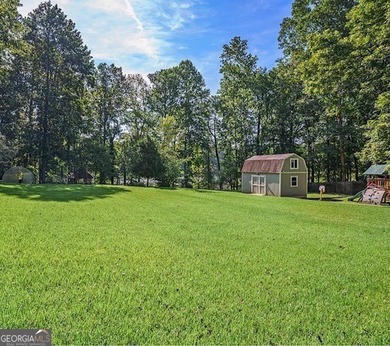 This sprawling lake estate featuring six bedrooms and five baths - photo 11