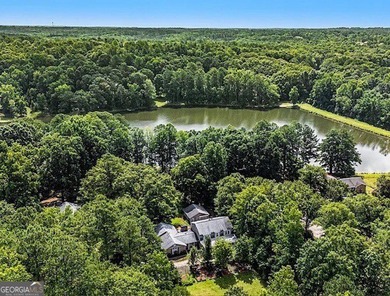This sprawling lake estate featuring six bedrooms and five baths - photo 14