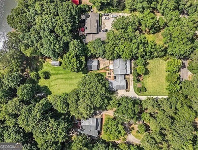 This sprawling lake estate featuring six bedrooms and five baths - photo 15