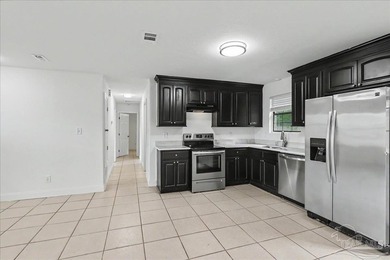 Welcome to this beautifully updated 3-bedroom, 2-bath brick home - photo 12