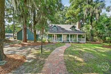 Located on a corner lot in Coffee Bluff Plantation, this - photo 1