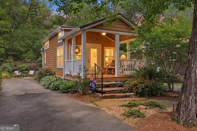 Nestled along a peaceful creek in the gated Sugar Mill Creek at - photo 1