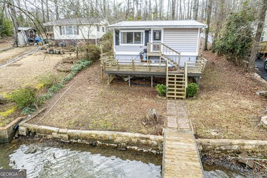 DEEDED LAKEFRONT RETREAT Welcome to an elevated lakeside - photo 1