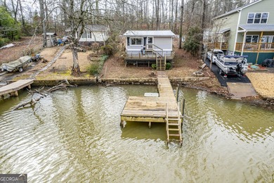 DEEDED LAKEFRONT RETREAT Welcome to an elevated lakeside - photo 2