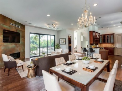 No HOA for this elegant corner townhome with tall ceilings and