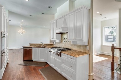 No HOA for this elegant corner townhome with tall ceilings and