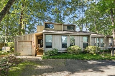 Priced to sell & nestled within the gates of Beau Chene, this - photo 1