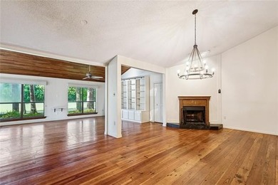 Priced to sell & nestled within the gates of Beau Chene, this - photo 3