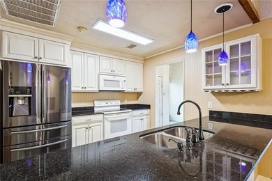 Priced to sell & nestled within the gates of Beau Chene, this - photo 6