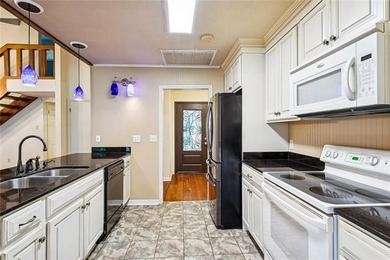 Priced to sell & nestled within the gates of Beau Chene, this - photo 7