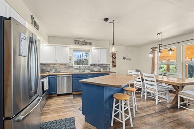 Perched above Lake Roosevelt on 10 private acres, this charming - photo 12