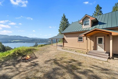 Perched above Lake Roosevelt on 10 private acres, this charming - photo 33