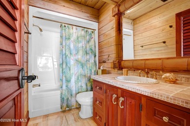 A truly unique oceanfront opportunity in Topsail Beach, this