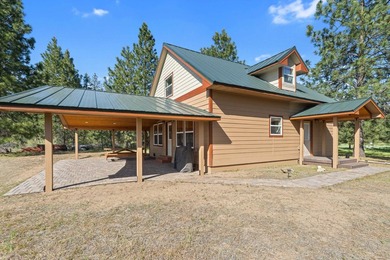 Perched above Lake Roosevelt on 10 private acres, this charming - photo 42