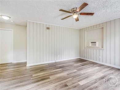 Solid and low-maintenance, this all-brick triplex sits in Garden - photo 4
